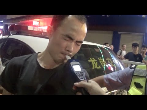 Hilarious Video: Drunk Driver Fails to Fool Breathalyzer in south China City
