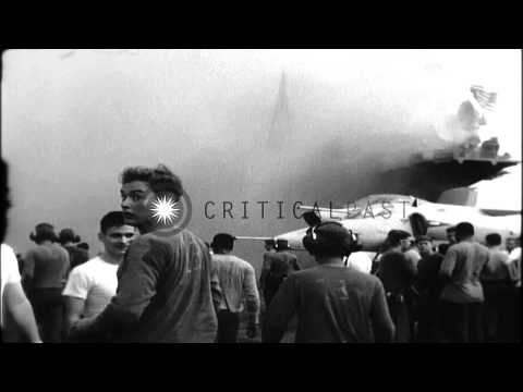 Crew of USS Oriskany (CVA-34) fights an accidental fire started from a flare.  In...HD Stock Footage